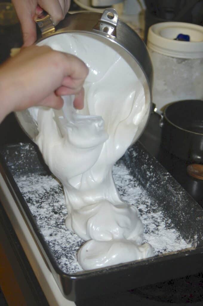 pouring homemade marshmallows in pan