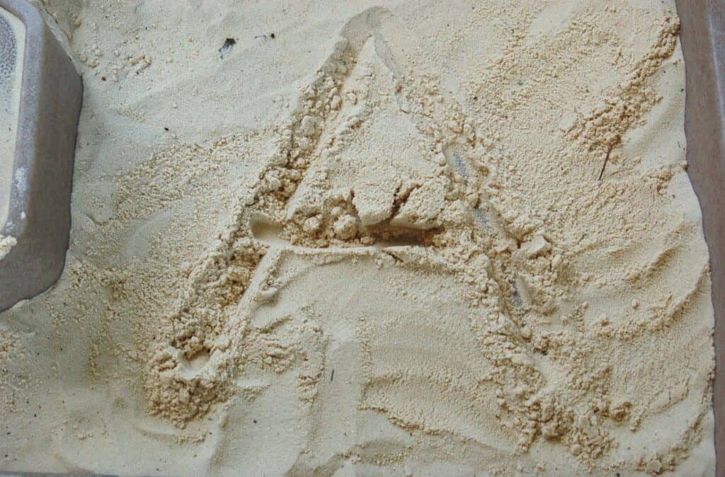 alphabet letter A in sand