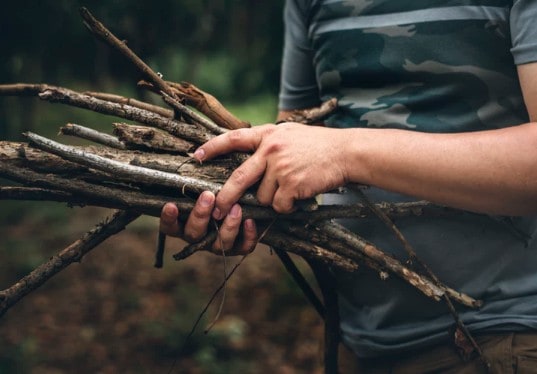 boys hands holding sticks