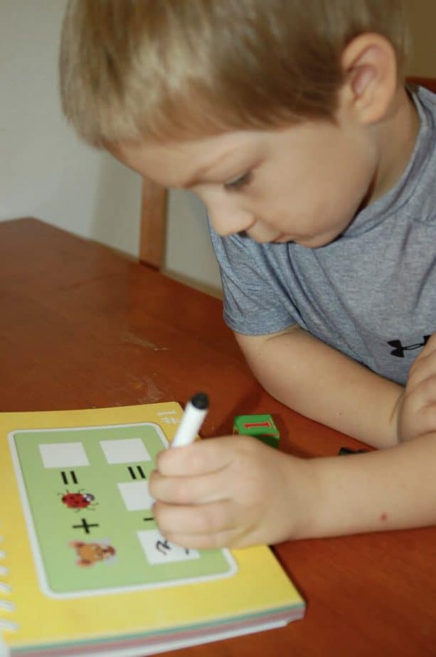 boy writing math game