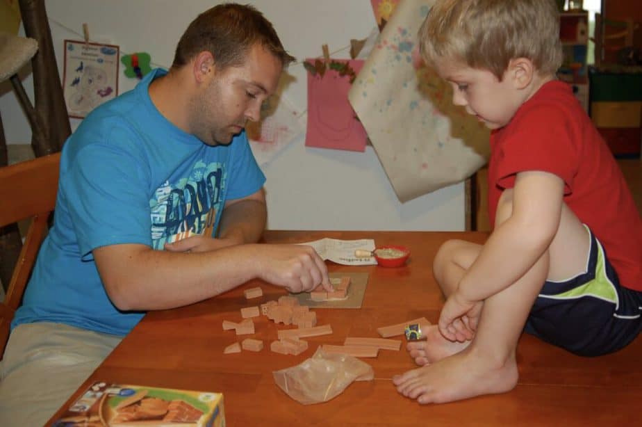 dad and son building bricks