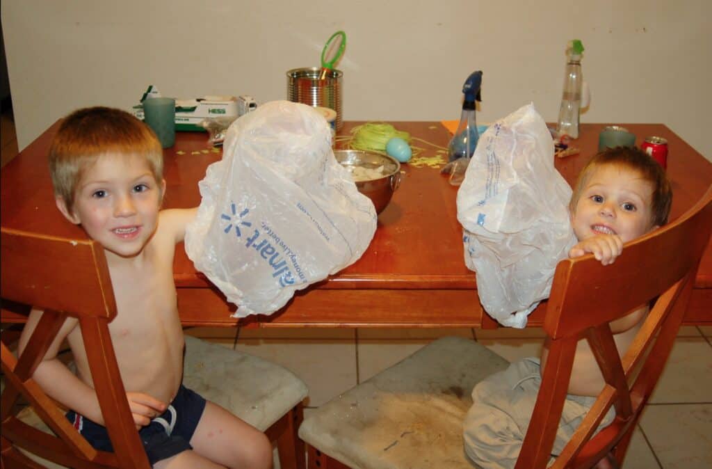 boys doing ice science experiment