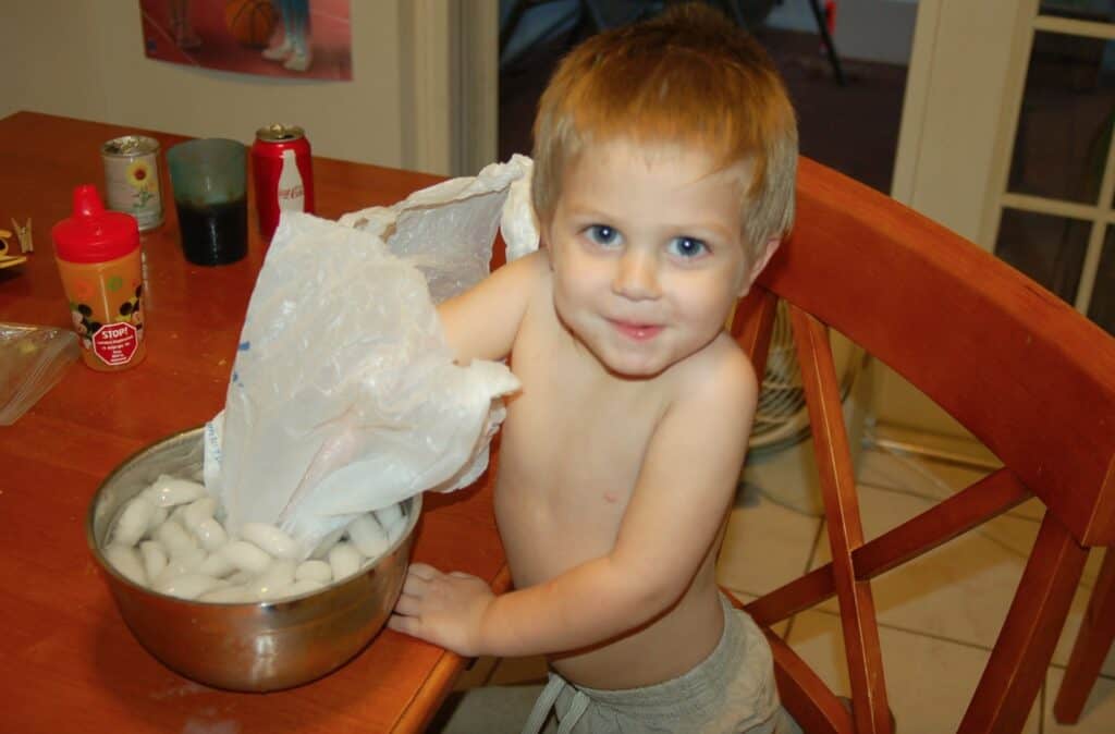 preschool boy doing science experiment