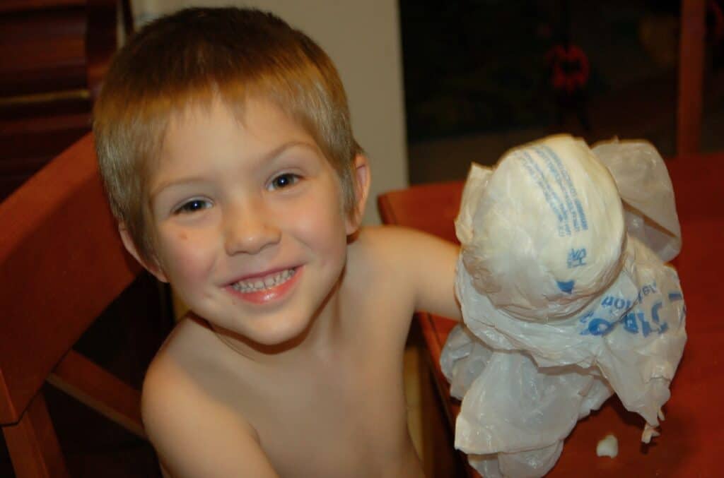 boy doing blubber science experiment