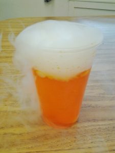 orange dry ice bubbling drink 