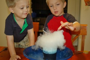 boys with dry ice clouds science experiment