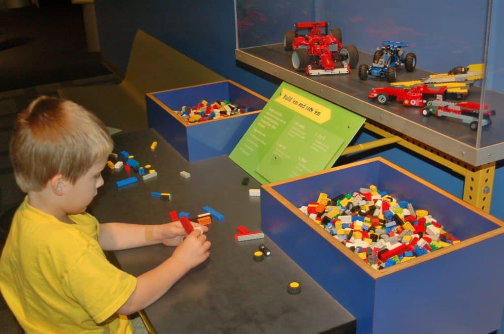 building LEGO cars at the Des Moines Science Center of Iowa