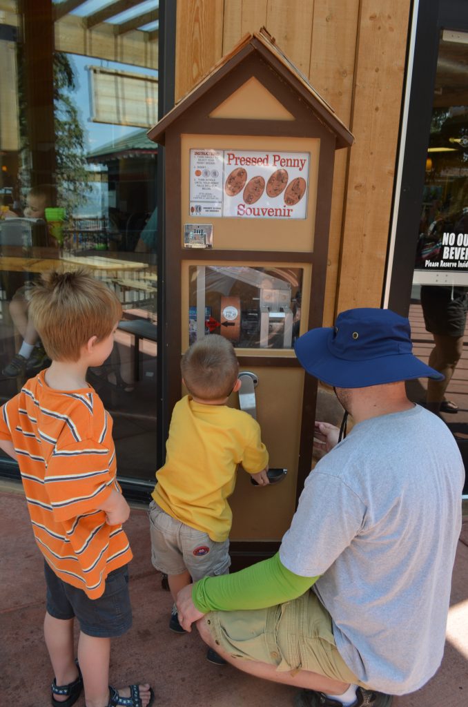 boys using pressed penny machine