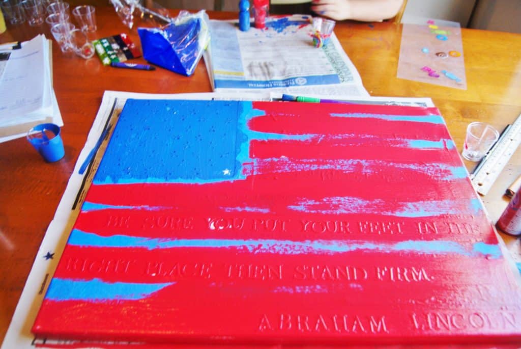 red paint in process diy flag canvas craft