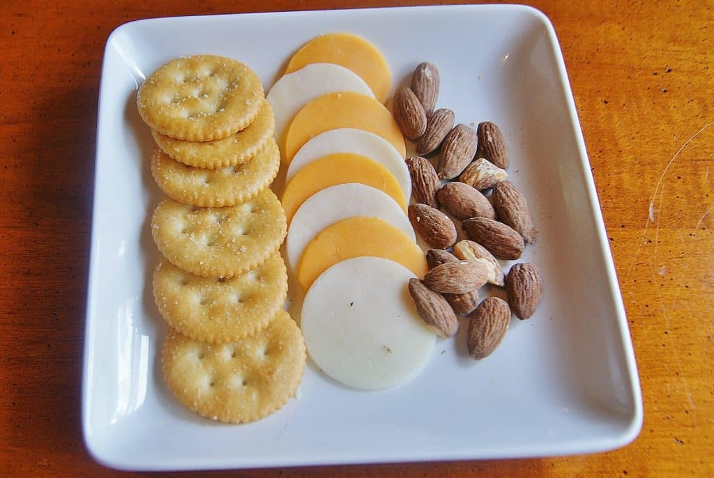 snack tray of crackers, cheese and nuts