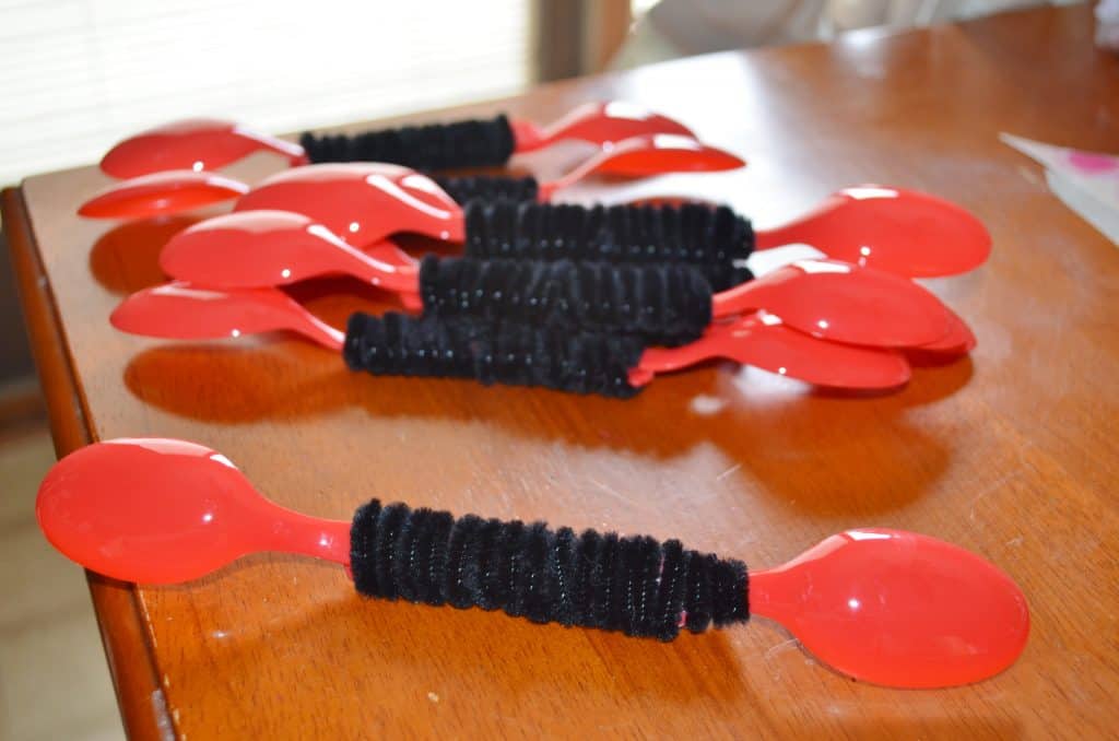 red spoons with black pipe cleaners bug craft