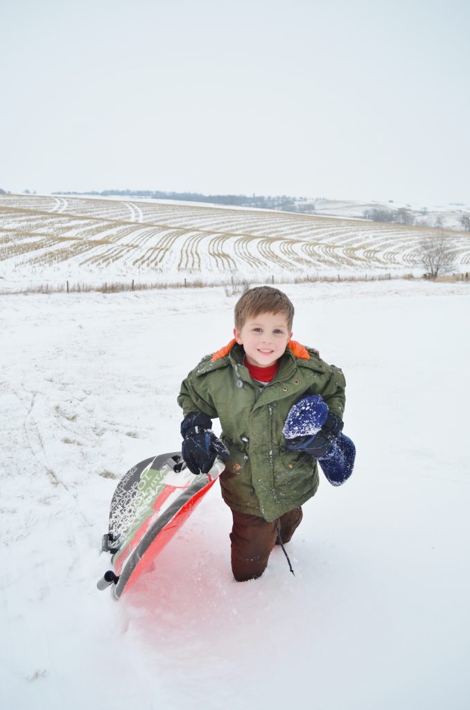 snowboarding sledding in the snow