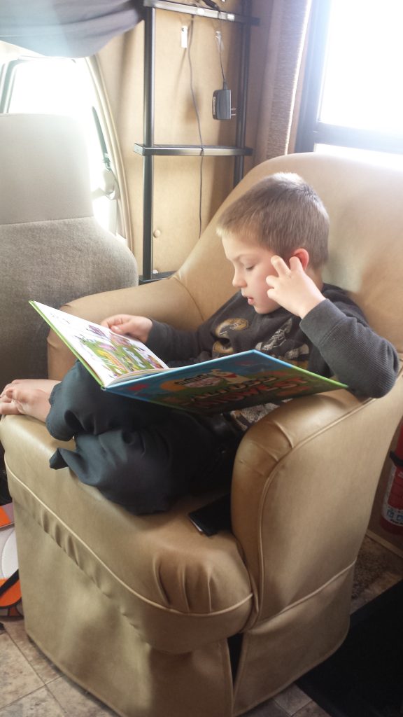 kid reading book