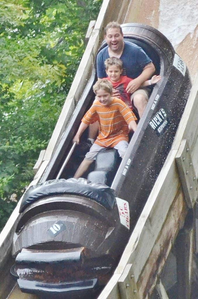 family riding american plunge water ride in branson