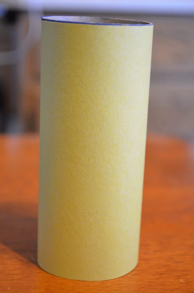 yellow paper on toilet paper tube