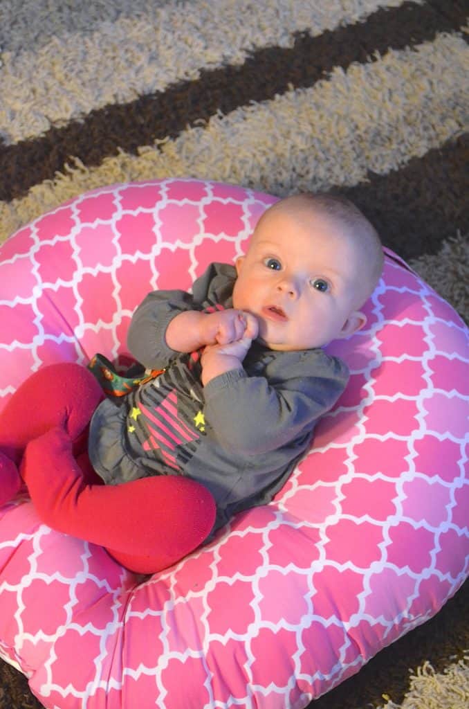 baby girl in Boppy Newborn Lounger