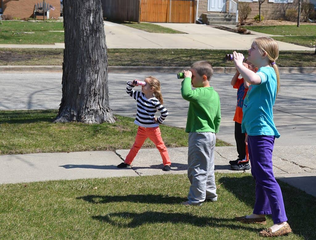 kids looking through binoculars going on a bear hunt