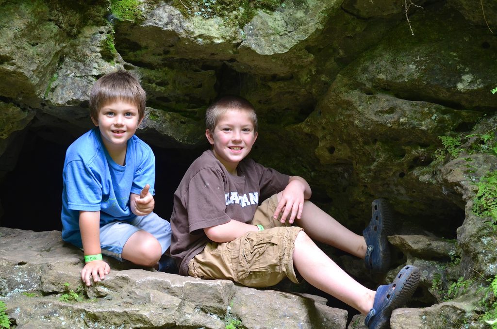 boys inside a cave in Maquoketa State Park