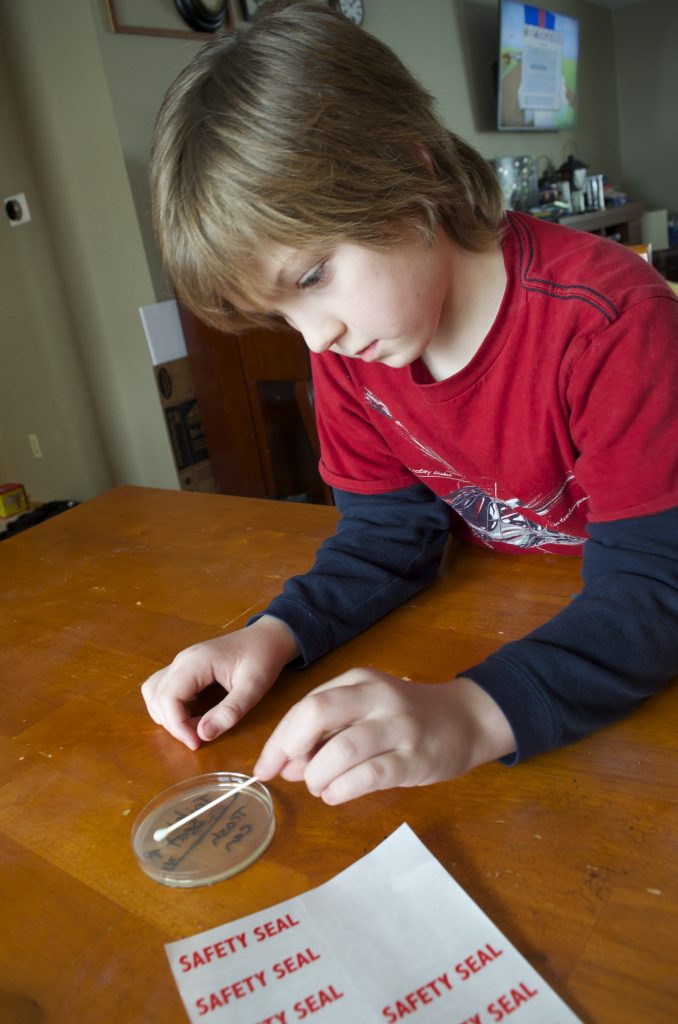 boy doing science experiment