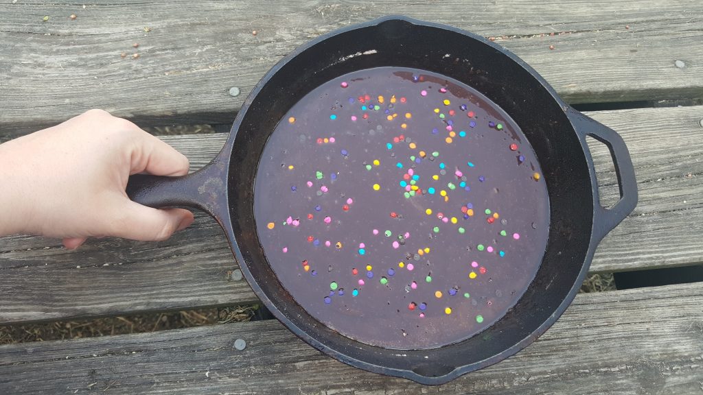 Brownies over the Campfire: Making Family Memories - Just cut a half of a Pillsbury Brownie Mix box in half, mix in your cast iron pan, and bake over the campfire!