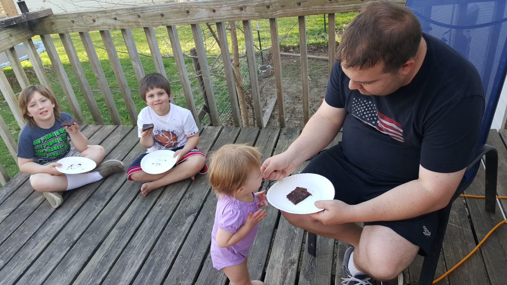 Brownies over the Campfire: Making Family Memories - Just cut a half of a Pillsbury Brownie Mix box in half, mix in your cast iron pan, and bake over the campfire!