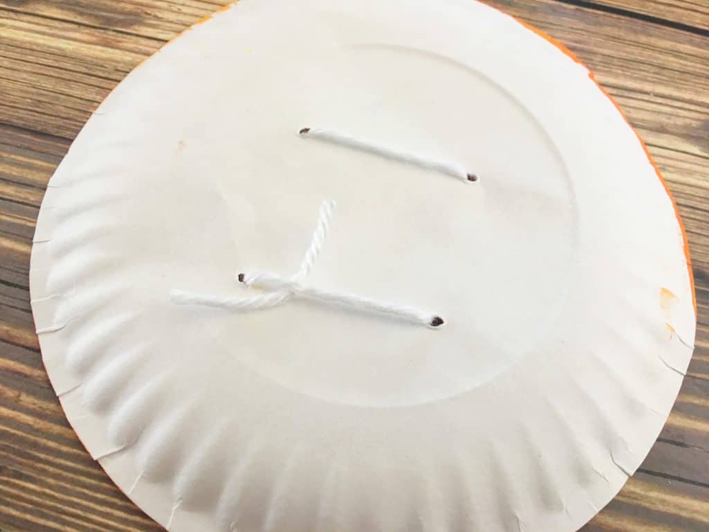 white paper plate with white string craft