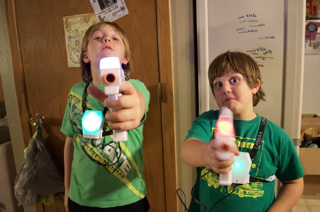 two boys playing laser x laser tag