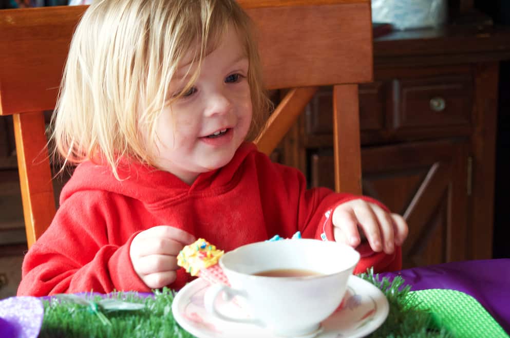 little girl at pretend play tea party