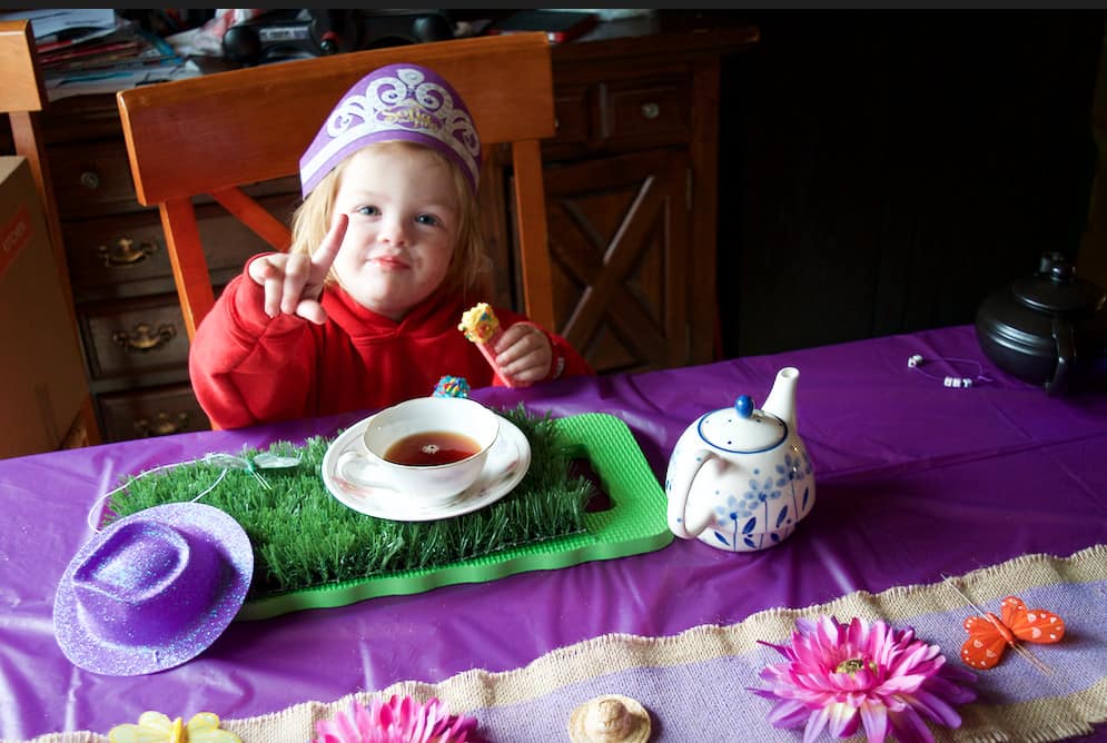 little girl at a magical tea party