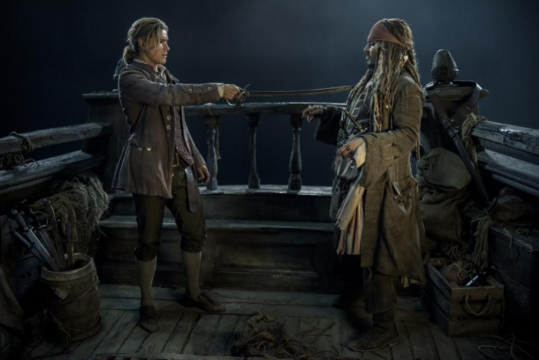 Brenton Thwaites & Johnny Depp in Pirates of the Caribbean