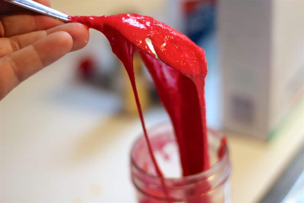 red gooey lava slime on spoon