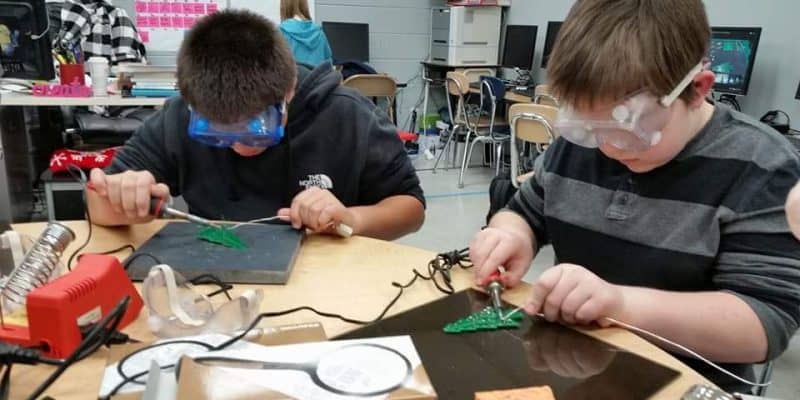middle school students soldering