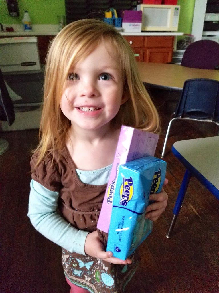 little girl holding PEEPS Easter Candy