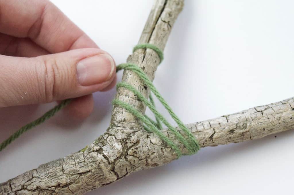 yarn wrapped around stick camping craft