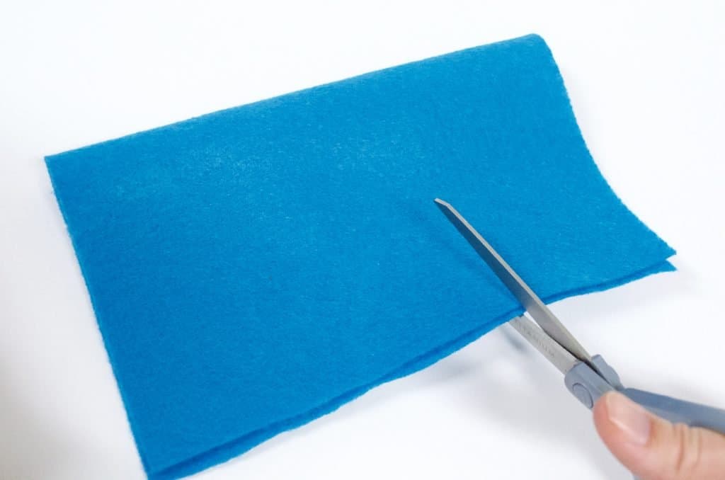 cutting blue felt craft