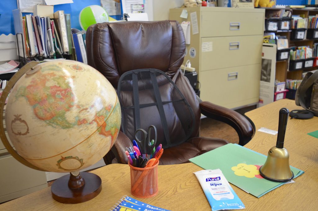 teacher desk in classroom with PURELL Hand Wipes