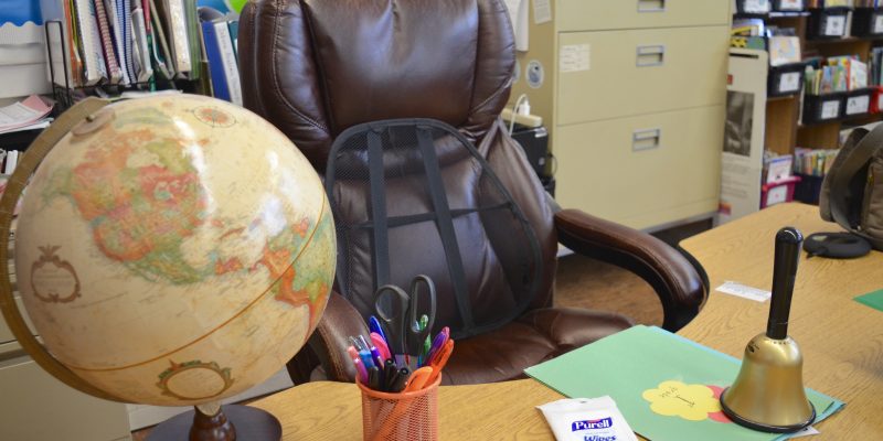 teacher desk in classroom with PURELL Hand Wipes