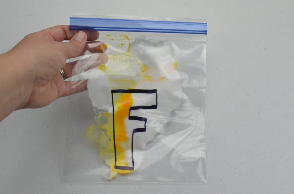 letter F with shaving cream in bag sensory play