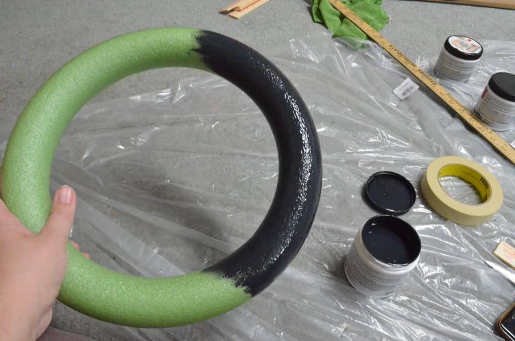 green round styrofoam wreath ring painted black