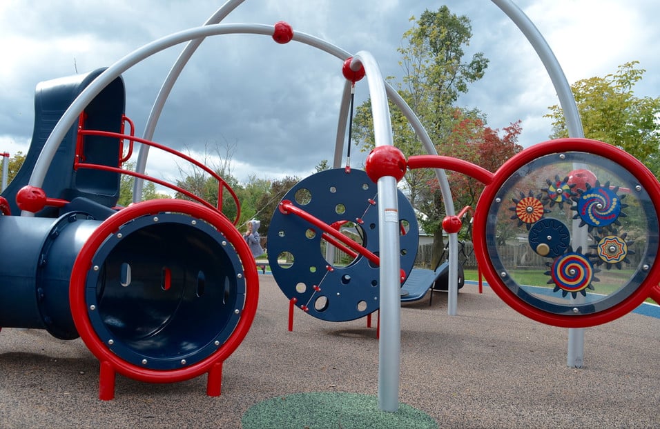 blue and red inclusive playground equipment