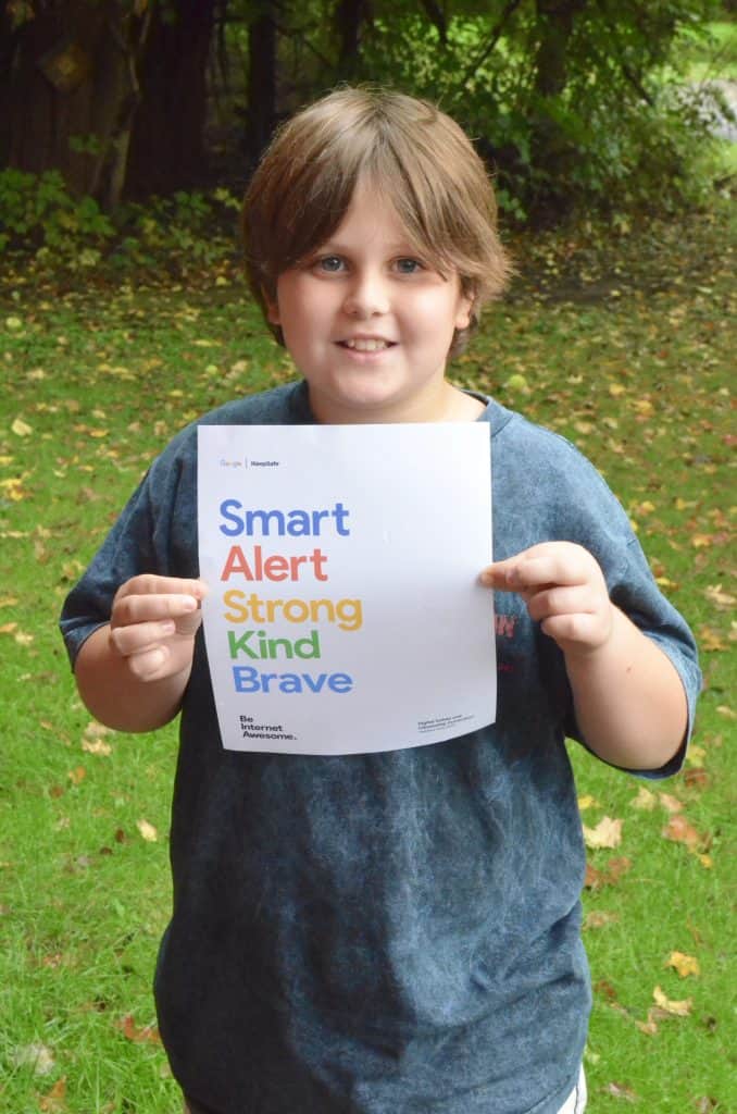 boy holding kindness Google Be Internet Safe poster