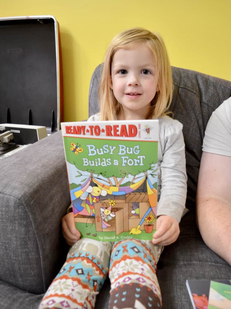 girl with Ready to Read level book