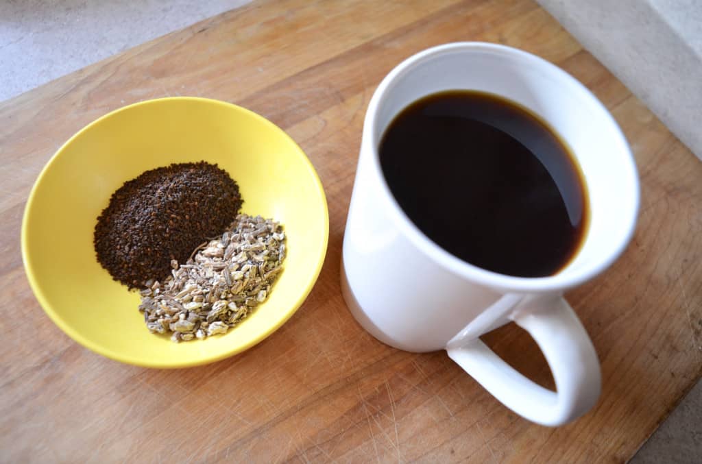 Paleo AIP coffee in white mug with dandelion chicory root in bowl