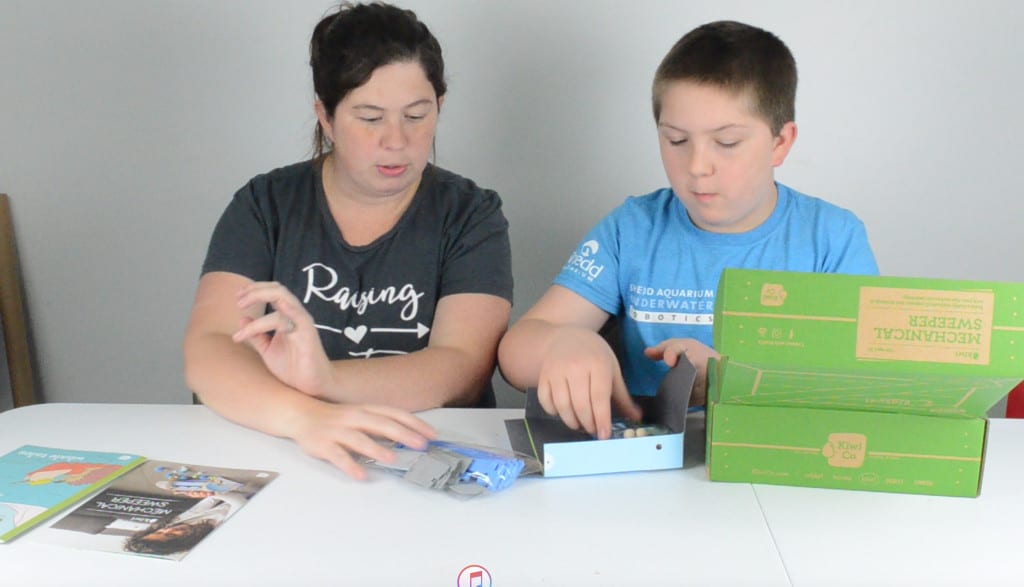 mother and son unboxing STEM subscription box