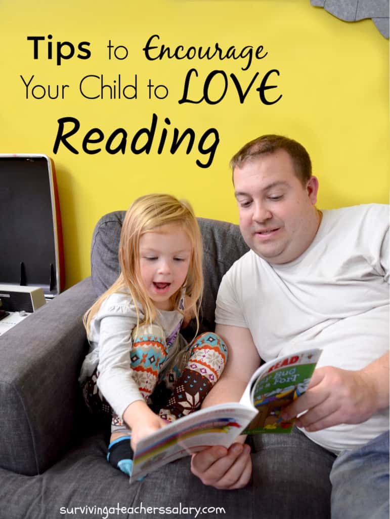 preschool girl reading with father