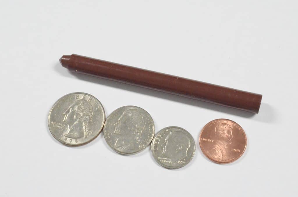 american money coins and brown crayon