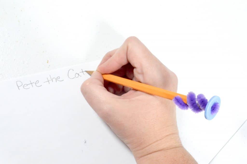 writing with button pencil toppers