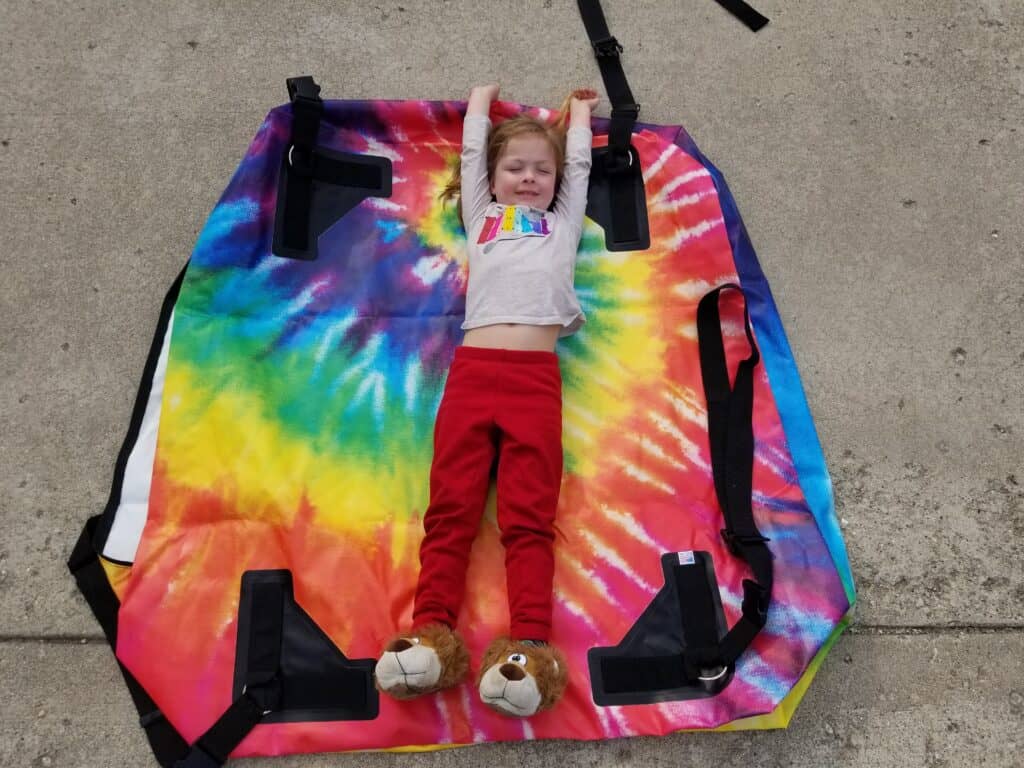 little girl on tie dye background