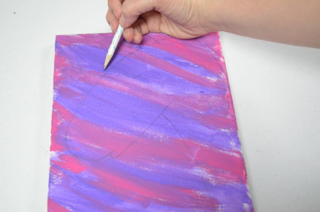 draw in pencil unicorn on purple canvas