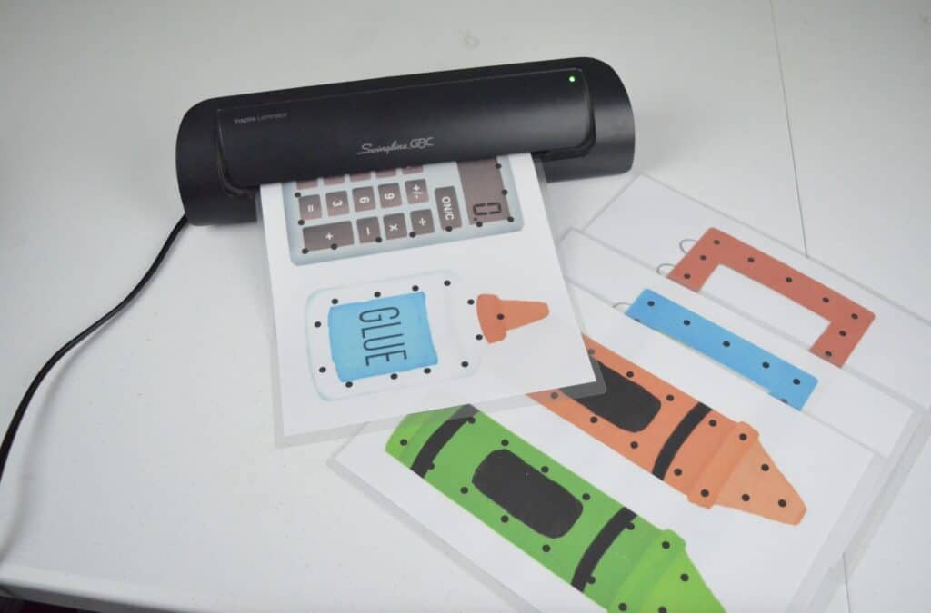 laminating school supply lacing cards activity